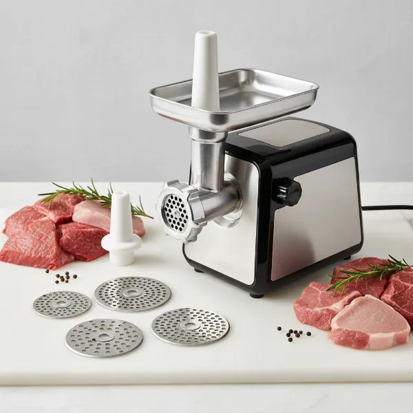 Electric meat grinder with multiple attachments and raw meat cuts, demonstrating versatility for home chefs.