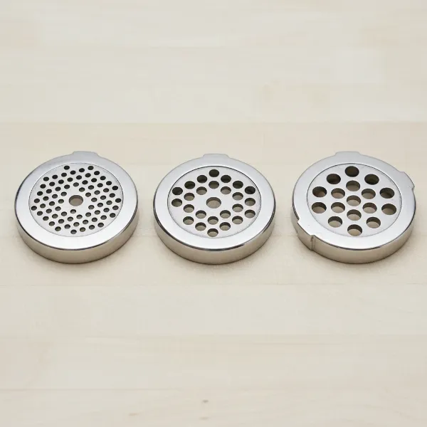 Different sizes of meat grinder plates, showing fine, medium, and coarse hole diameters.