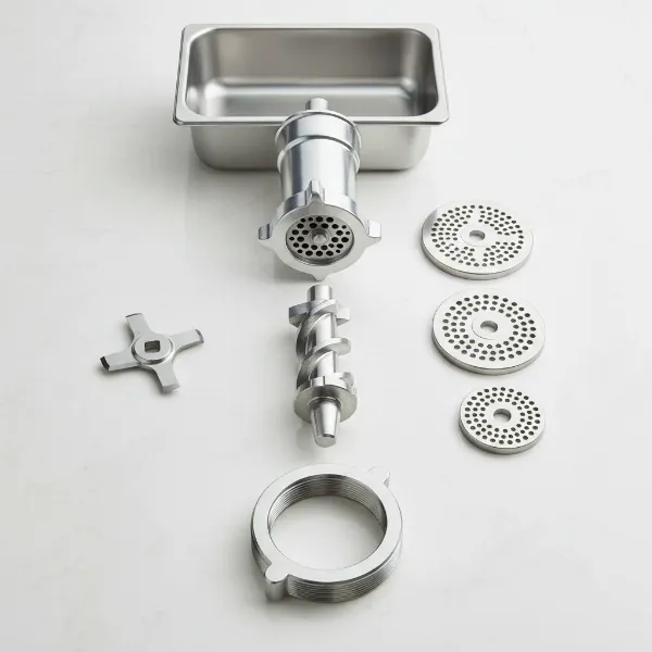 Disassembled stainless steel components of a meat grinder, showing auger, blade, and plates for cleaning.